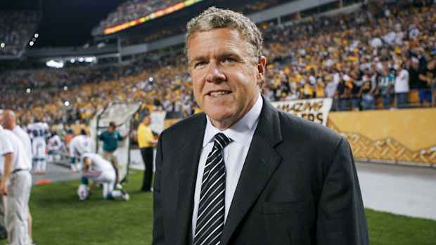 Peter King walks on a field